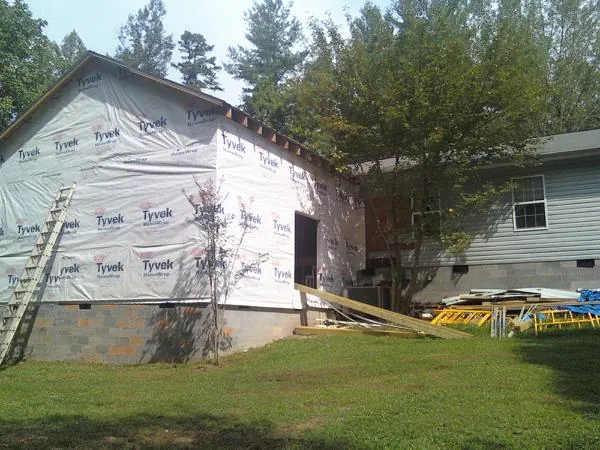Tyvek wrapped gable on a new room addition beside an existing home in Murrieta